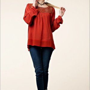 Burnt orange lace yoke long sleeve peasant top